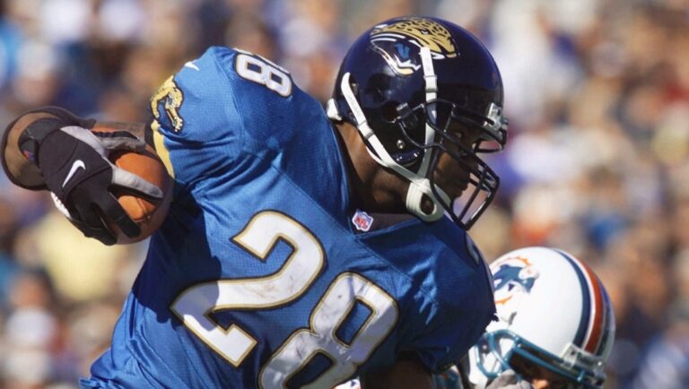 Jacksonville Jaguars running back Fred Taylor (28) beats a Miami Dolphins defender on his way to a 90-yard touchdown run during the first quarter their AFC divisional playoff game Saturday, Jan. 15, 2000, in Jacksonville, Fla.. (AP Photo/Tony Gutierrez)