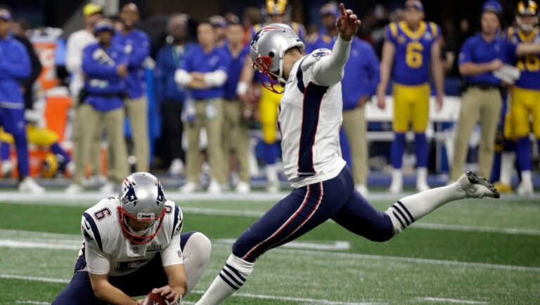 New England Patriots' Stephen Gostkowski (3) kicks a field goal as Ryan Allen (6) holds during the second half of the team's NFL Super Bowl 53 football game against the Los Angeles Rams in Atlanta.