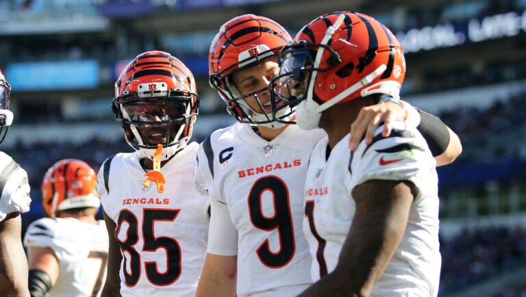 Cincinnati Bengals quarterback Joe Burrow (9) and Cincinnati Bengals wide receiver Ja'Marr Chase (1) celebrate during an NFL football game against the Baltimore Ravens, Sunday, Oct. 24, 2021 in Baltimore, Md. (AP Photo/Daniel Kucin Jr.)