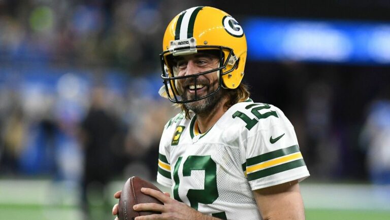Green Bay Packers quarterback Aaron Rodgers smiles during pregame of an NFL football game against the Detroit Lions, Sunday, Jan. 9, 2022.