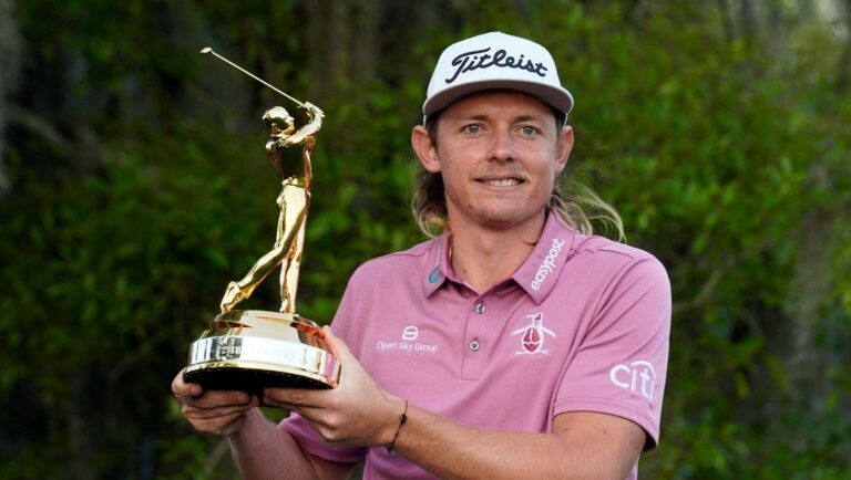 Cameron Smith, of Australia, holds the trophy after winning The Players Championship golf tournament Monday, March 14, 2022, in Ponte Vedra Beach, Fla.