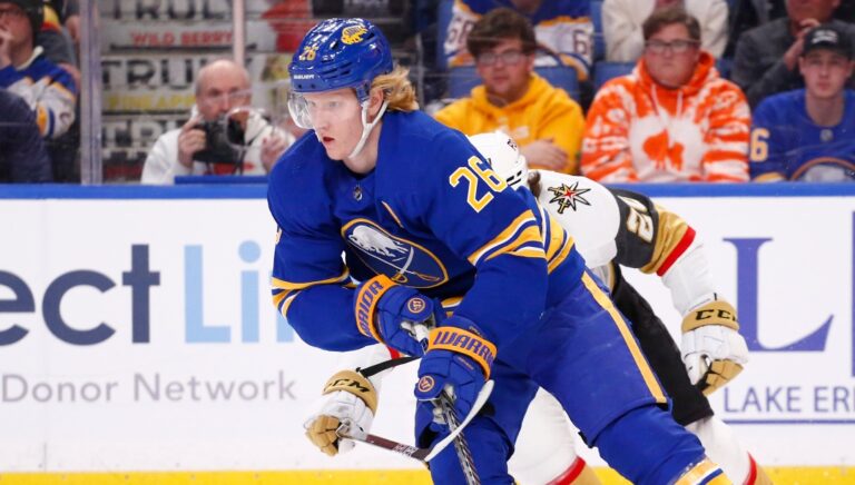 Buffalo Sabres defenseman Rasmus Dahlin (26) carries the puck during the second period of an NHL hockey game against the Vegas Golden Knights, Thursday, March 10, 2022, in Buffalo, N.Y. (AP Photo/Jeffrey T. Barnes)