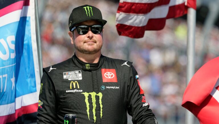 Kurt Busch on pit road during driver introductions before the NASCAR Daytona 500 auto race at Daytona International Speedway, Sunday, Feb. 20, 2022, in Daytona Beach, Fla. (AP Photo/John Raoux)