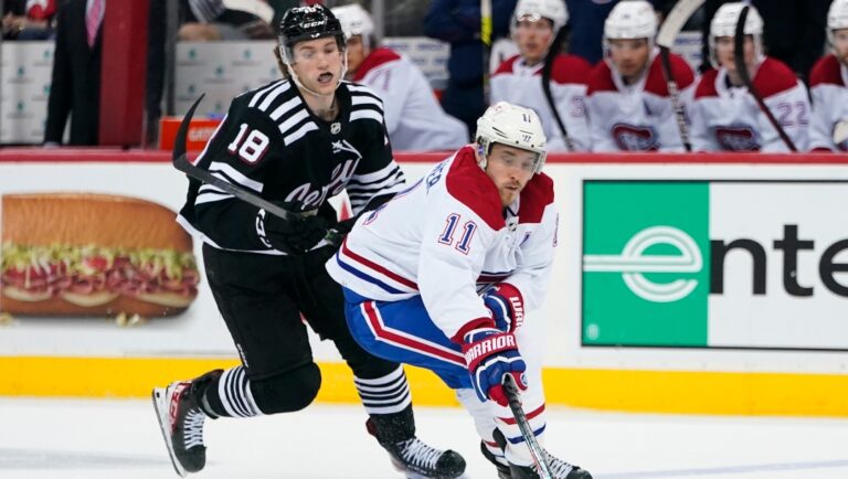 Montreal Canadiens' Brendan Gallagher (11) competes for control of the puck with New Jersey Devils' Dawson Mercer (18) during the third period of an NHL hockey game Thursday, April 7, 2022, in Newark, N.J. The Canadiens won 7-4. (AP Photo/Frank Franklin II)