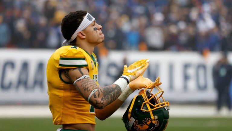 North Dakota State wide receiver Christian Watson (1) claps to the music played in the stadium during the second half of the FCS Championship NCAA college football game against Montana State, Saturday, Jan. 8, 2022, in Frisco, Texas.