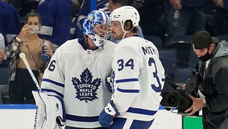 Toronto Maple Leafs goaltender Jack Campbell (36) and center Auston Matthews (34) celebrate after the team defeated the Tampa Bay Lightning during Game 3 of an NHL hockey first-round playoff series Friday, May 6, 2022, in Tampa, Fla.