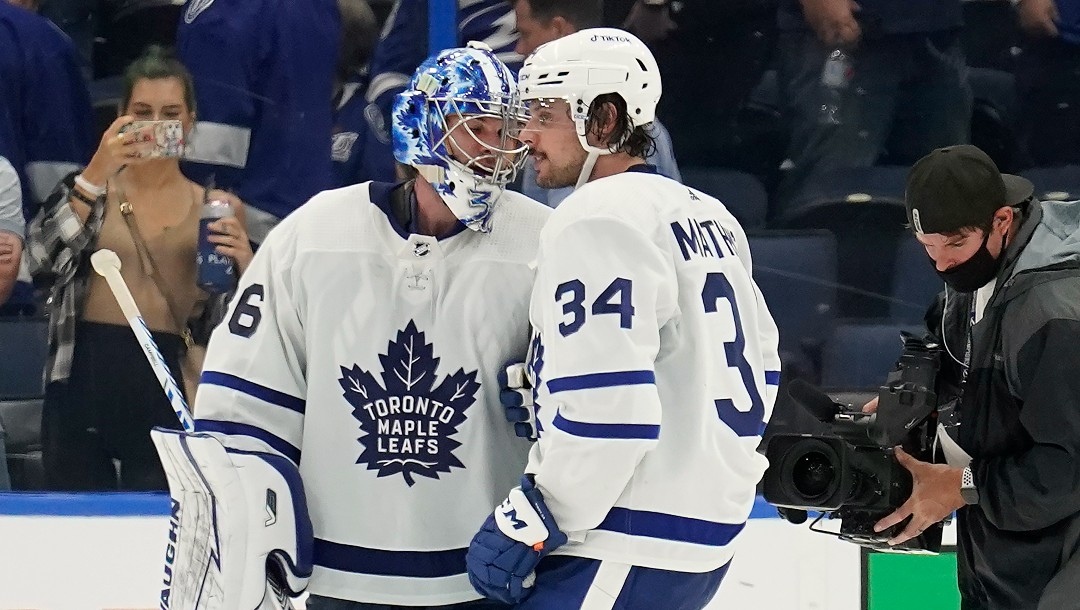 Toronto Maple Leafs goaltender Jack Campbell (36) and center Auston Matthews (34) celebrate after the team defeated the Tampa Bay Lightning during Game 3 of an NHL hockey first-round playoff series Friday, May 6, 2022, in Tampa, Fla.