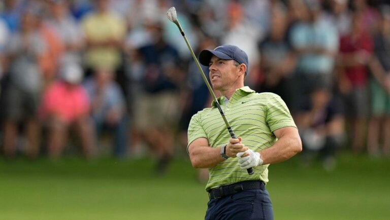 Rory McIlroy, of Northern Ireland, hits from the fairway on the 12th hole during the first round of the PGA Championship golf tournament, Thursday, May 19, 2022, in Tulsa, Okla.