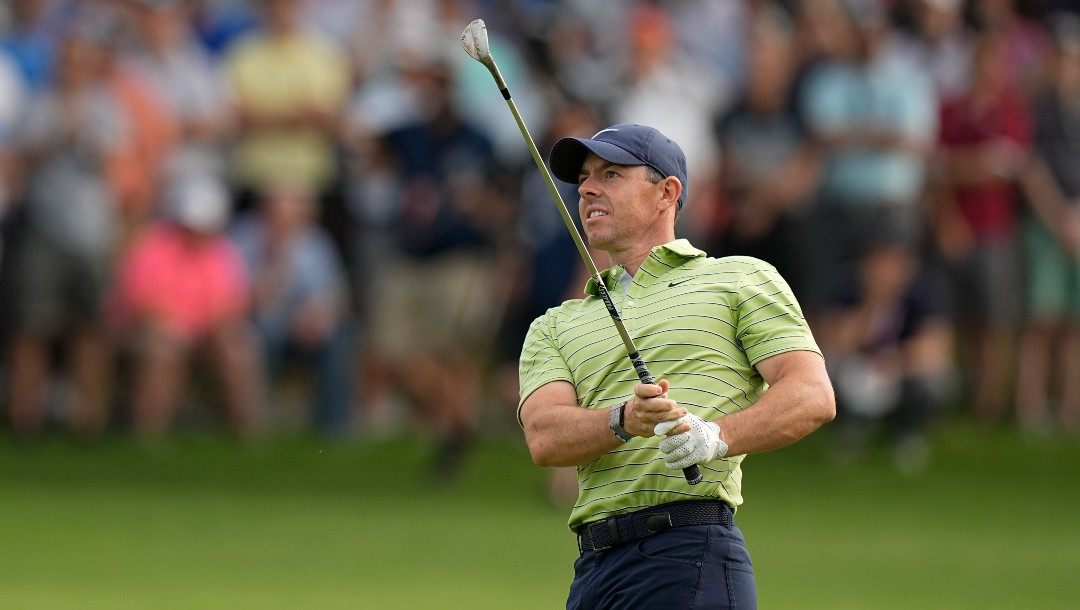 Rory McIlroy, of Northern Ireland, hits from the fairway on the 12th hole during the first round of the PGA Championship golf tournament, Thursday, May 19, 2022, in Tulsa, Okla.