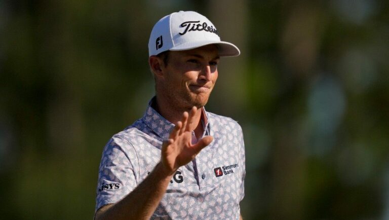 Will Zalatoris waves to the gallery on the 18th hole after finishing his final round at the Masters golf tournament on Sunday, April 10, 2022, in Augusta, Ga.