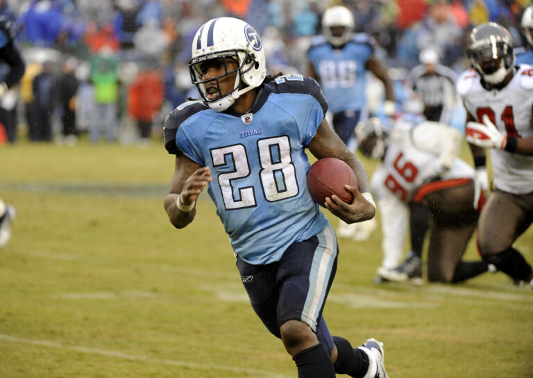 Chris Johnson running with the ball playing for the Tennessee Titans with the number 28