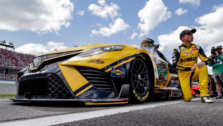 Christopher Bell gets ready to lead the start of a NASCAR Cup Series auto race Sunday, April 24, 2022, in Talladega, Ala. (AP Photo/Butch Dill)