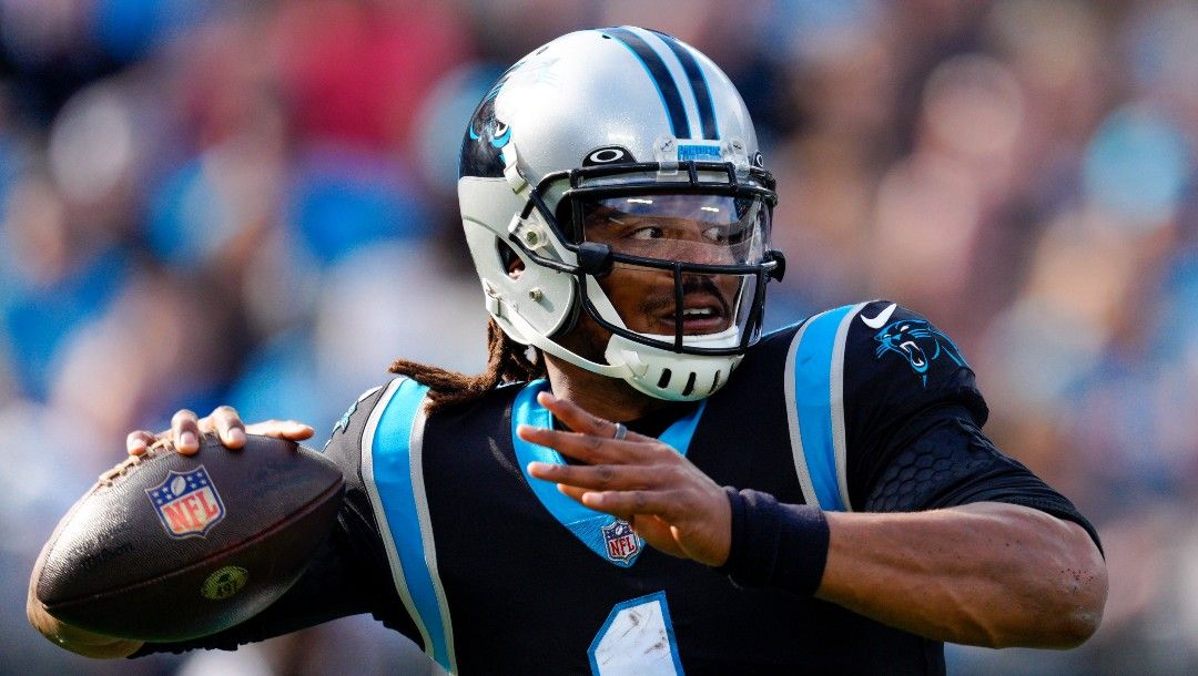 Carolina Panthers quarterback Cam Newton passes against the Tampa Bay Buccaneers during the first half of an NFL football game on Dec. 26, 2021, in Charlotte, N.C.