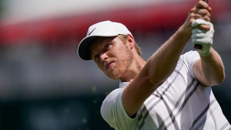 Cam Davis watches his shot on the 16th hole during the first round of the Travelers Championship golf tournament at TPC River Highlands, Thursday, June 23, 2022, in Cromwell, Conn.