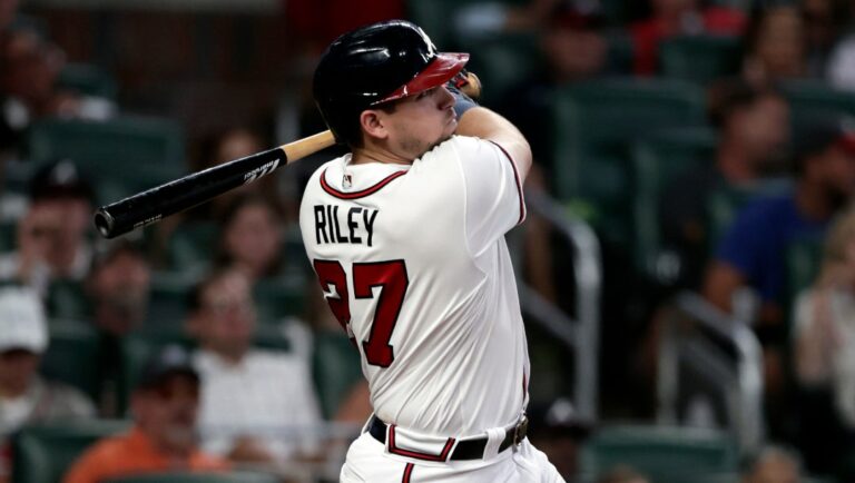 Atlanta Braves' Austin Riley hits a two-run home run against the Los Angeles Angels during the fourth inning of a baseball game Saturday, July 23, 2022, in Atlanta.