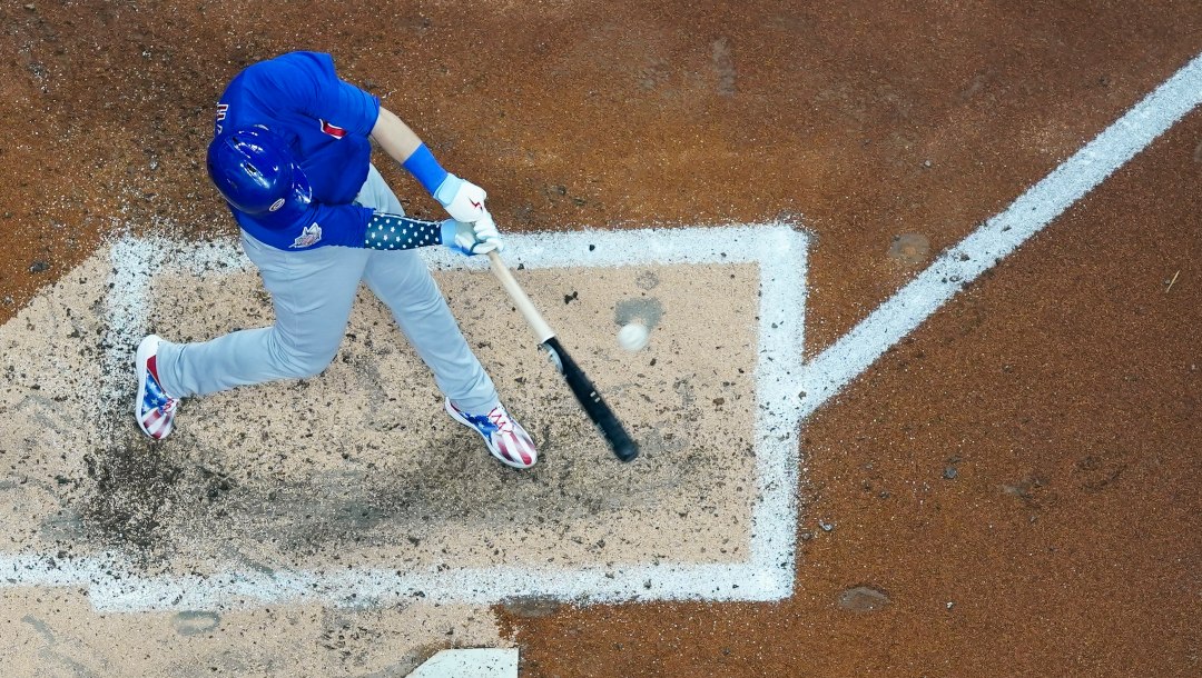 Chicago Cubs' Ian Happ hits a double during the fourth inning of a baseball game against the Milwaukee Brewers Monday, July 4, 2022, in Milwaukee.