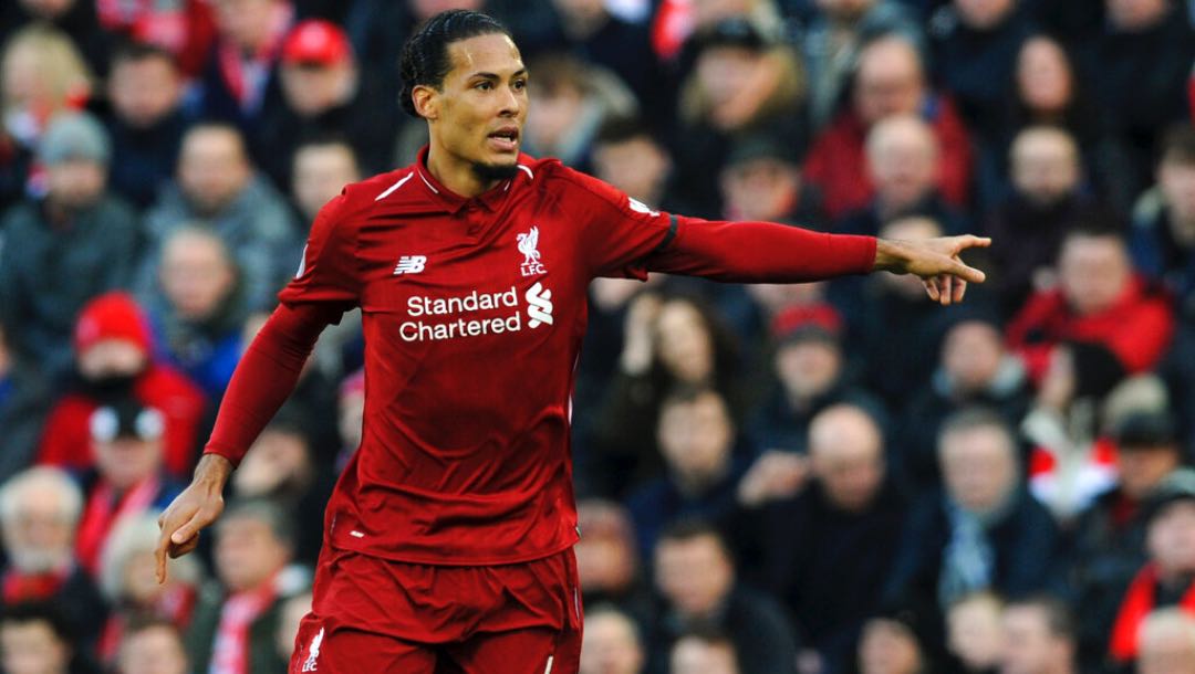 Liverpool's Virgil van Dijk gestures during an English Premier League soccer match.