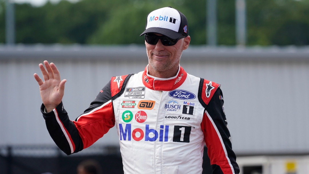 Kevin Harvick greets fans during driver introductions prior to the start of a NASCAR Cup Series auto race at Richmond Raceway, Sunday, Aug. 14, 2022, in Richmond, Va. (AP Photo/Steve Helber)