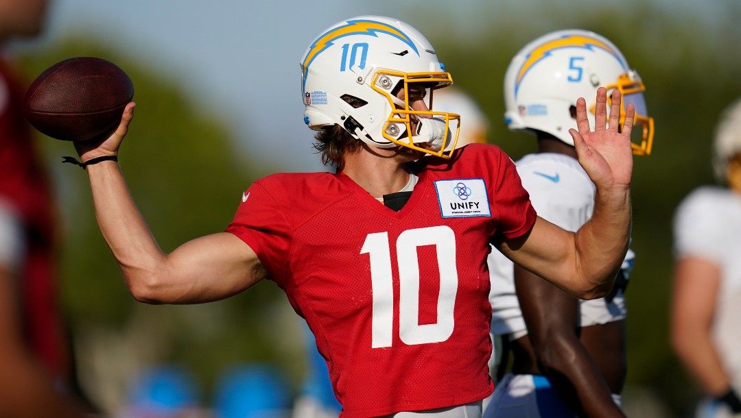 Los Angeles Chargers quarterback Justin Herbert (10) participates in drills at the NFL football team's practice facility in Costa Mesa, Calif. Sunday, Aug. 7, 2022.