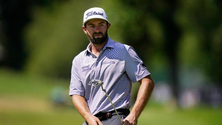Cameron Young watches his putt on the ninth green during the final round of the Rocket Mortgage Classic golf tournament, Sunday, July 31, 2022, in Detroit.