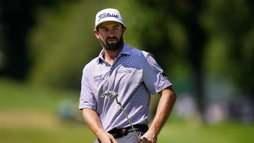 Cameron Young watches his putt on the ninth green during the final round of the Rocket Mortgage Classic golf tournament, Sunday, July 31, 2022, in Detroit.