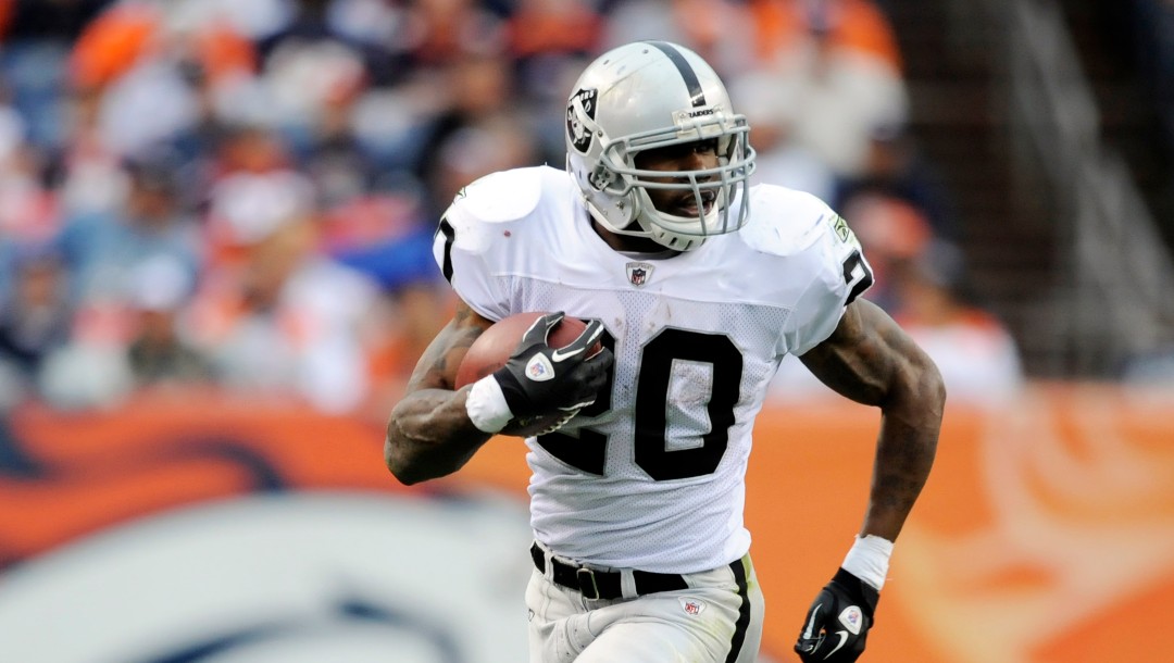 Oakland Raiders running back Darren McFadden (20) runs for a touchdown against the Denver Broncos during an NFL football game Sunday, Oct. 24, 2010, in Denver. (AP Photo/Jack Dempsey)