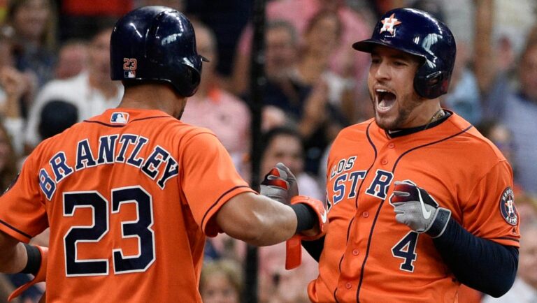 Houston Astros' George Springer, right, celebrates his two-run home run off Los Angeles Angels relief pitcher Jose Rodriguez with Michael Brantley during the second inning of a baseball game Sunday, Sept. 22, 2019, in Houston.