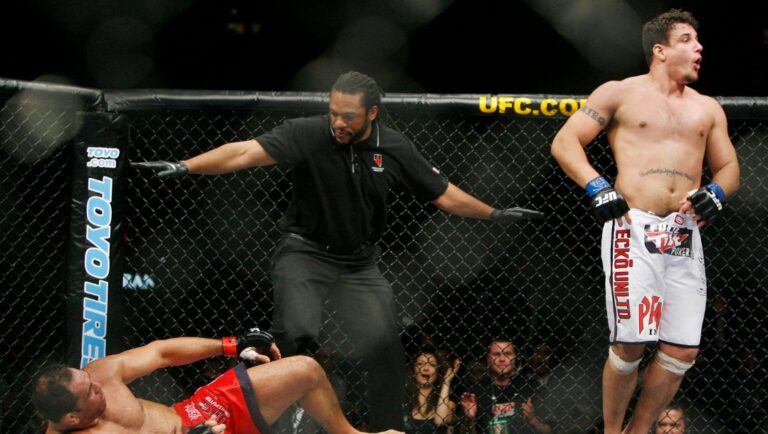 Frank Mir celebrates his second round TKO of Antonio Rodrigo Nogueira as referee Herb Dean stops the fight.