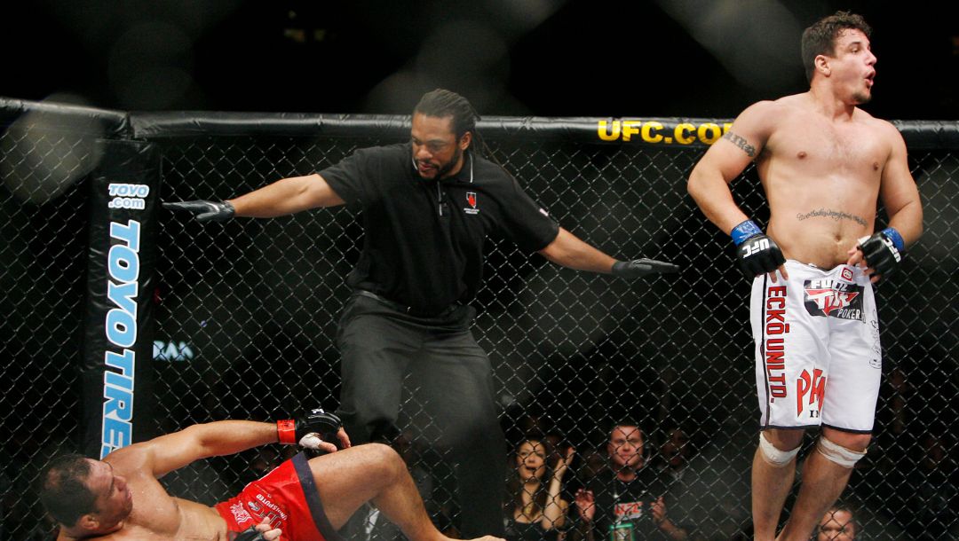 Frank Mir celebrates his second round TKO of Antonio Rodrigo Nogueira as referee Herb Dean stops the fight.