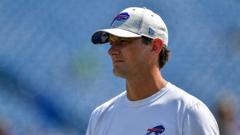 Buffalo Bills offensive coordinator Ken Dorsey walks on the field before a preseason NFL football game against the Denver Broncos in Orchard Park, N.Y., Saturday, Aug. 20, 2022. (AP Photo/Adrian Kraus)
