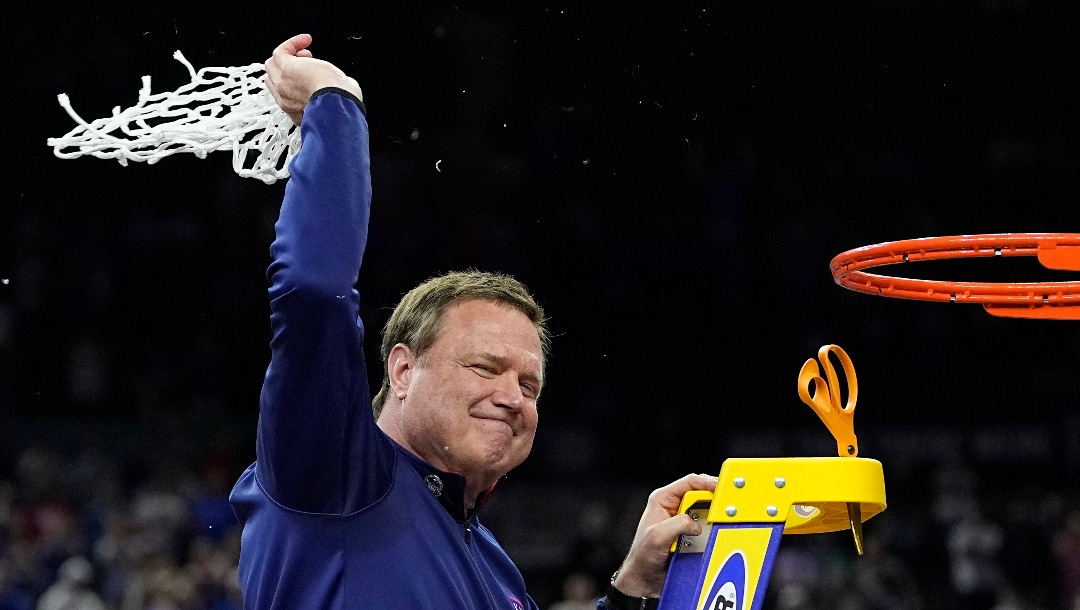 Kansas head coach Bill Self cuts the net after their win against North Carolina in a college basketball game at the finals of the Men's Final Four NCAA tournament, Monday, April 4, 2022, in New Orleans. (AP Photo/David J. Phillip)