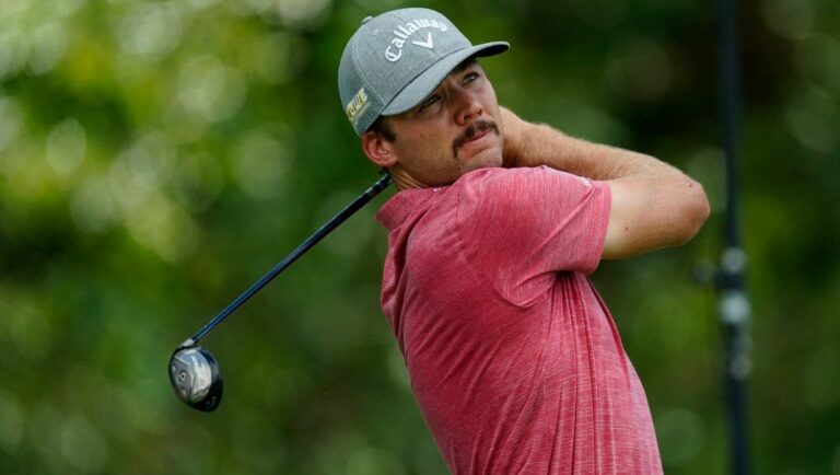 Sam Burns hits off the third tee during the second round of the Tour Championship golf tournament at East Lake Golf Club, Friday, Aug. 26, 2022, in Atlanta.