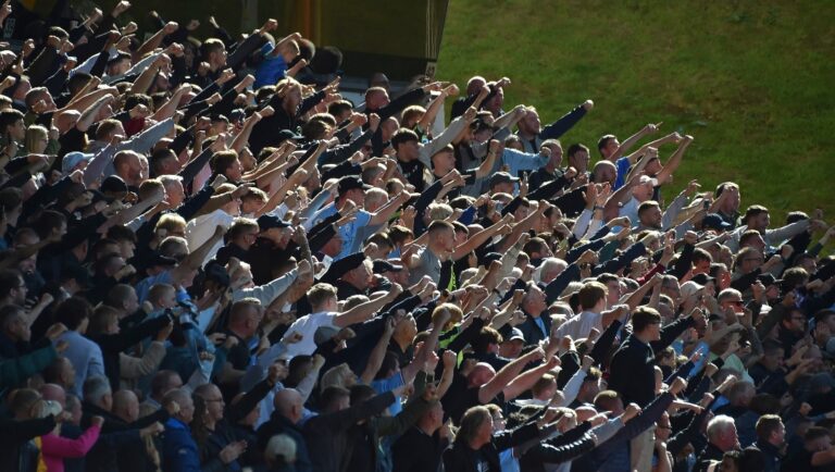 Supporters cheer during the English Premier League soccer match between Wolverhampton Wanderers and Manchester City at Molineux stadium in Wolverhampton, England, Saturday, Sept. 17, 2022.