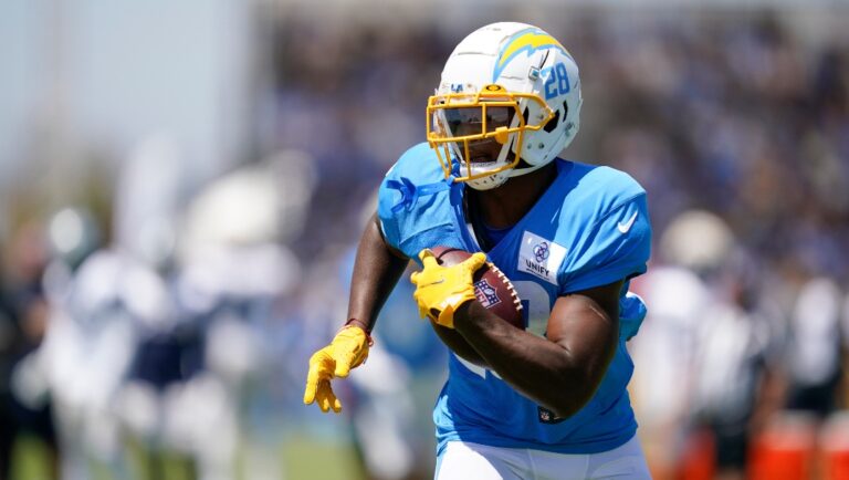Los Angeles Chargers running back Isaiah Spiller (28) participates in drills during a combined NFL practice with the Dallas Cowboys at the Los Angeles Rams' practice facility in Costa Mesa, Calif. Thursday, Aug. 18, 2022. (AP Photo/Ashley Landis)