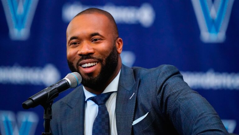 FILE - Villanova NCAA college basketball coach Kyle Neptune speaks with members of the media during a news conference in Villanova, Pa., Friday, April 22, 2022. Coming off a Final Four appearance, Villanova and new coach Kyle Neptune will face Tom Izzo’s Michigan State in one of the major attractions of the seventh Gavitt Tipoff Games. (AP Photo/Matt Rourke, File)