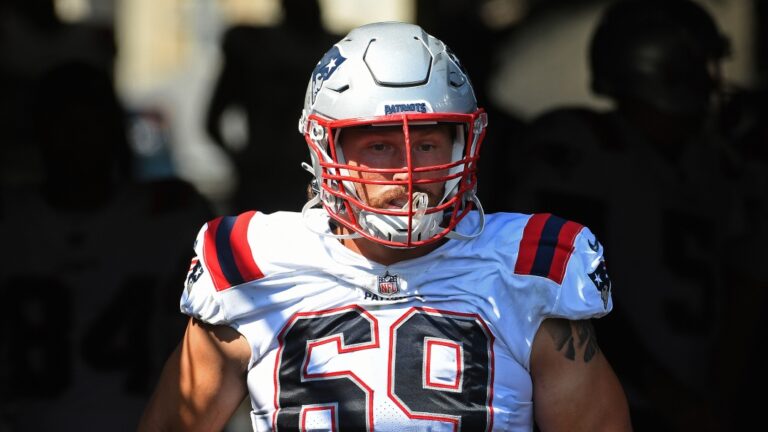 New England Patriots guard Cole Strange (69) takes the field