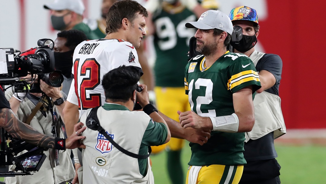 Tampa Bay Buccaneers quarterback Tom Brady, left, shakes hands with Green Bay Packers quarterback Aaron Rodgers after the Bucs defeated the Packers during an NFL football game Sunday, Oct. 18, 2020, in Tampa, Fla. (AP Photo/Mark LoMoglio)