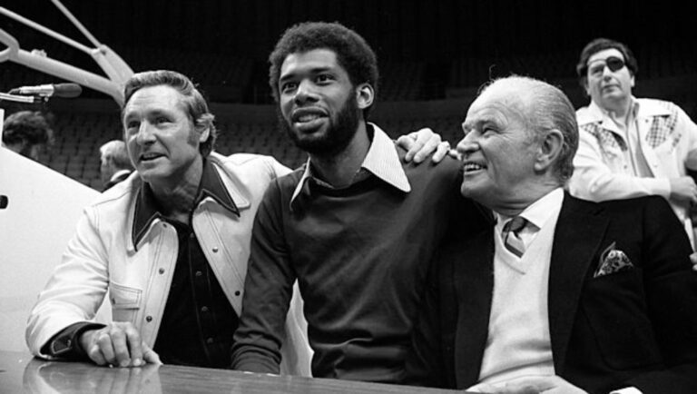 Bill Sharman, Kareem Abdul-Jabbar and Jack Kent Cooke at press conference announcing Lakers' signing Kareem in Los Angeles.