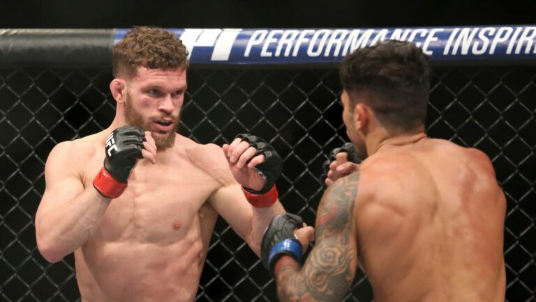 Dustin Ortiz, left, exchanges blows with Alexandre Pantoja during a mixed martial arts bout at UFC 220, Saturday, January 20, 2018.