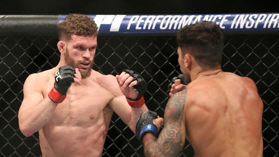 Dustin Ortiz, left, exchanges blows with Alexandre Pantoja during a mixed martial arts bout at UFC 220, Saturday, January 20, 2018.