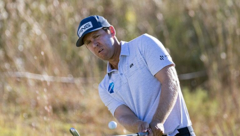 Seamus Power of Ireland chips onto the 18th green during the first round of the CJ Cup golf tournament Thursday, Oct. 20, 2022, in Ridgeland, S.C.