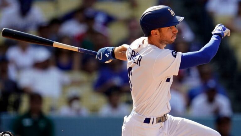 Los Angeles Dodgers' Trea Turner watches his RBI single against the San Francisco Giants during the eighth inning of a baseball game Wednesday, Sept. 7, 2022, in Los Angeles.