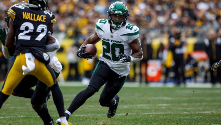 New York Jets running back Breece Hall (20) rushes