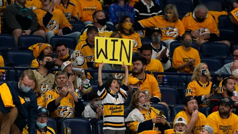 FILE - Nashville Predators fans cheer during the third period in Game 3 of an NHL hockey Stanley Cup first-round playoff series against the Carolina Hurricanes on Friday, May 21, 2021, in Nashville, Tenn. The NHL will holding its awards and draft in Music City in June 2023, the first time the league has held both in the same city since 2006, the league announced Thursday, Aug. 18, 2022. (AP Photo/Mark Humphrey, File)