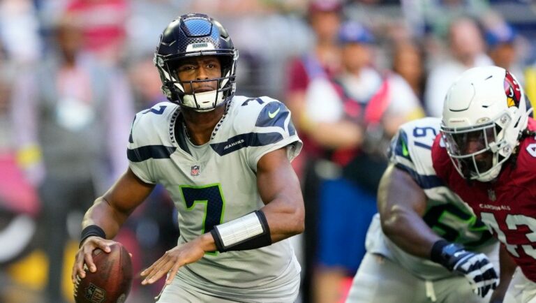 Seattle Seahawks quarterback Geno Smith (7) passes against the Arizona Cardinals during the first half of an NFL football game in Glendale, Ariz., Sunday, Nov. 6, 2022.