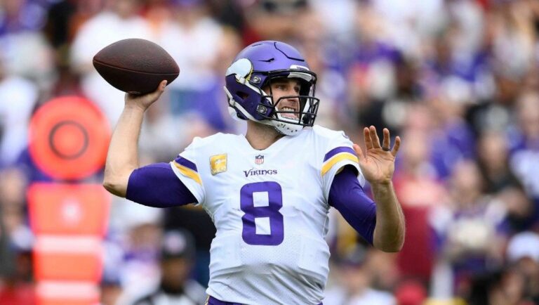 Minnesota Vikings quarterback Kirk Cousins (8) in action during the first half of an NFL football game against the Washington Commanders, Sunday, Nov. 6, 2022, in Landover, Md.