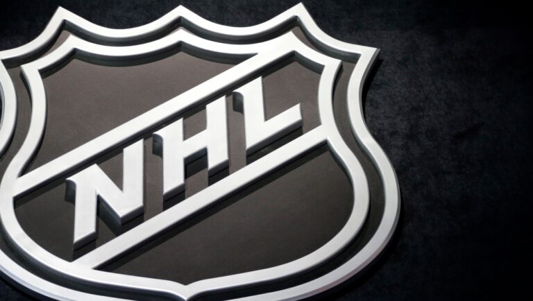 FILE - In this June 26, 2015, file photo, an NHL logo is shown before the start of the first round of the NHL hockey draft, in Sunrise, Fla. The NHL Free Agency period begins at noon Sunday, July 1, 2018. (AP Photo/Alan Diaz, File)