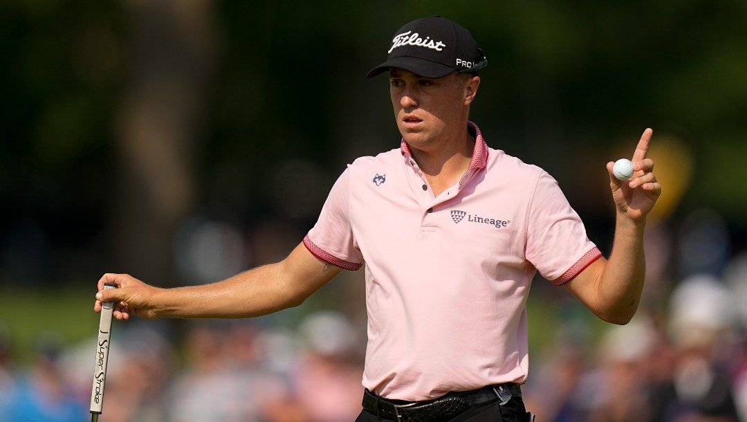 Justin Thomas celebrates after a birdie on the 17th hole during the final round of the PGA Championship golf tournament at Southern Hills Country Club, Sunday, May 22, 2022, in Tulsa, Okla.