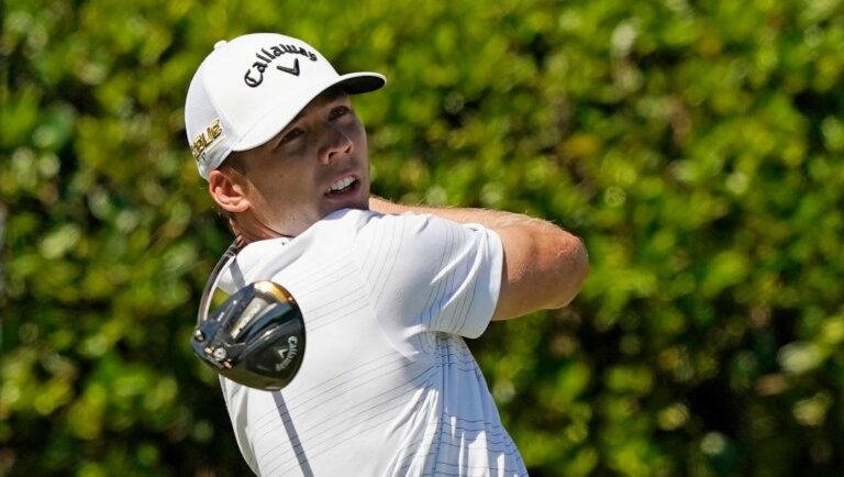 Sam Burns watches his drive on the first tee during the first day of the Sanderson Farms Championship golf tournament in Jackson, Miss., Thursday, Sept. 29, 2022. Burns is the defending champion.