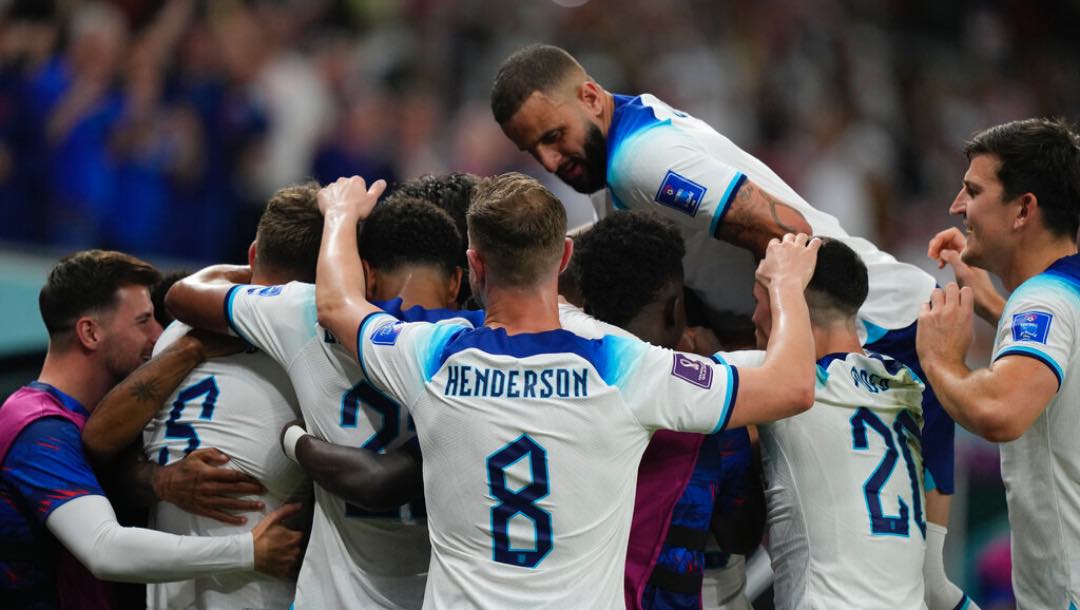 England's Marcus Rashford, right, celebrates after scoring during the World Cup group B soccer match between England and Wales, at the Ahmad Bin Ali Stadium in Al Rayyan , Qatar, Tuesday, Nov. 29, 2022.
